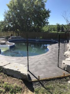 A concrete pool deck with swirl finishes by Capital Concrete Finishing